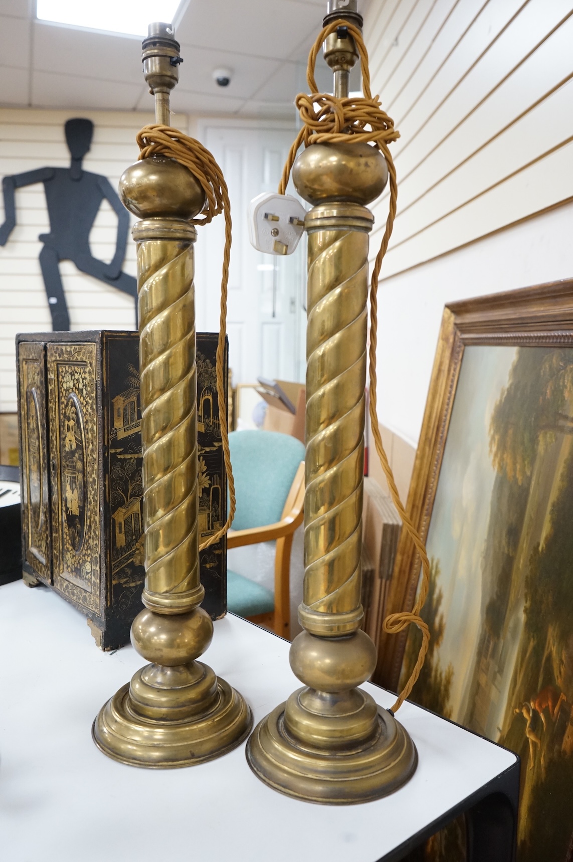A pair of tall brass fluted column table lamps and arise and fall desk lamp, largest each overall 64cm high
